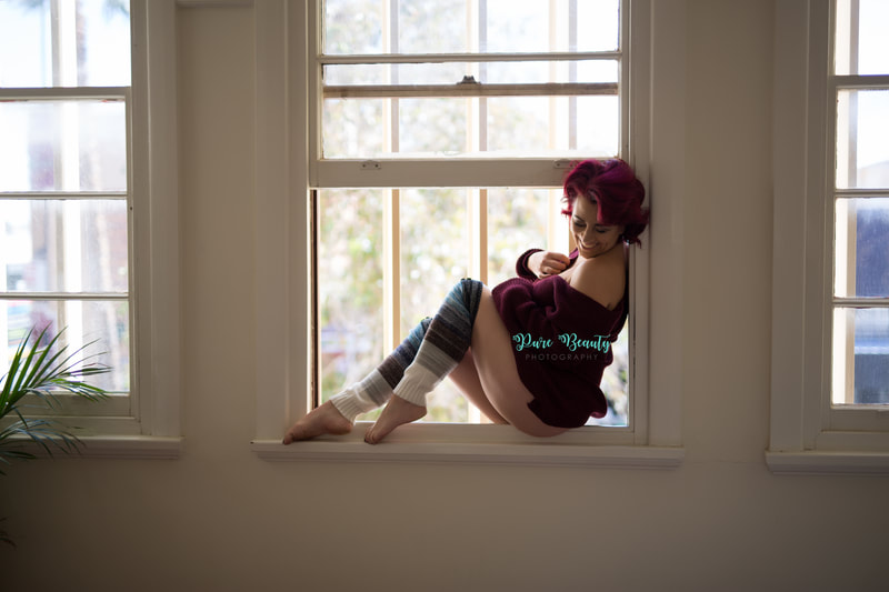 Boudoir image of woman in window frame
